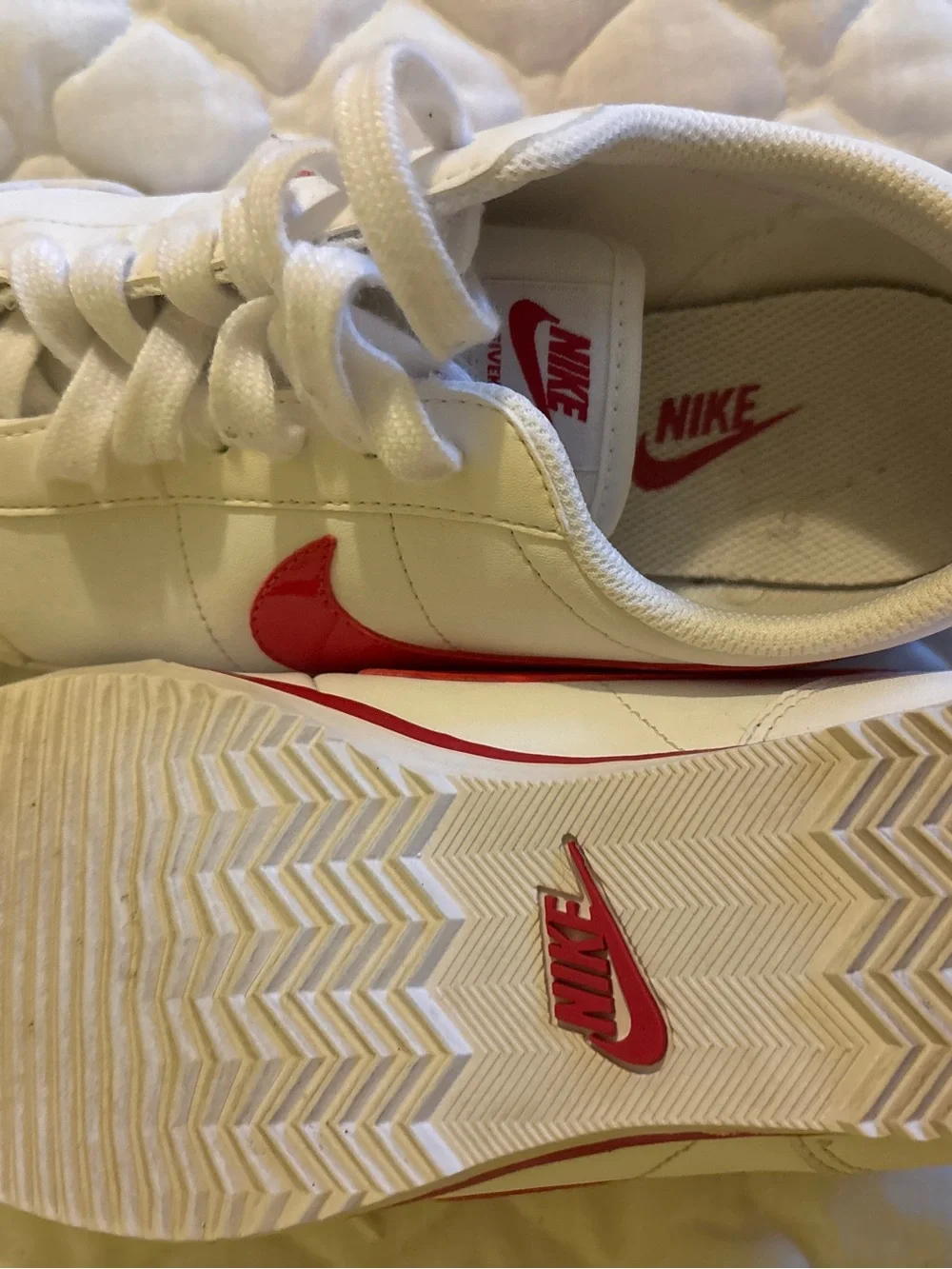 Nike White Sneakers with Pink Swoosh Accents